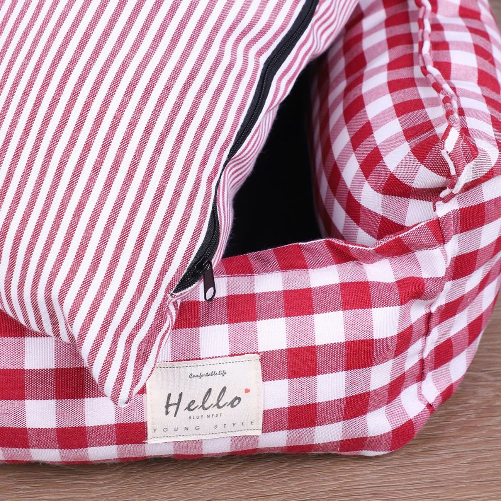 Détail de la fermeture éclair sur le coussin amovible d’un panier déhoussable pour chien 