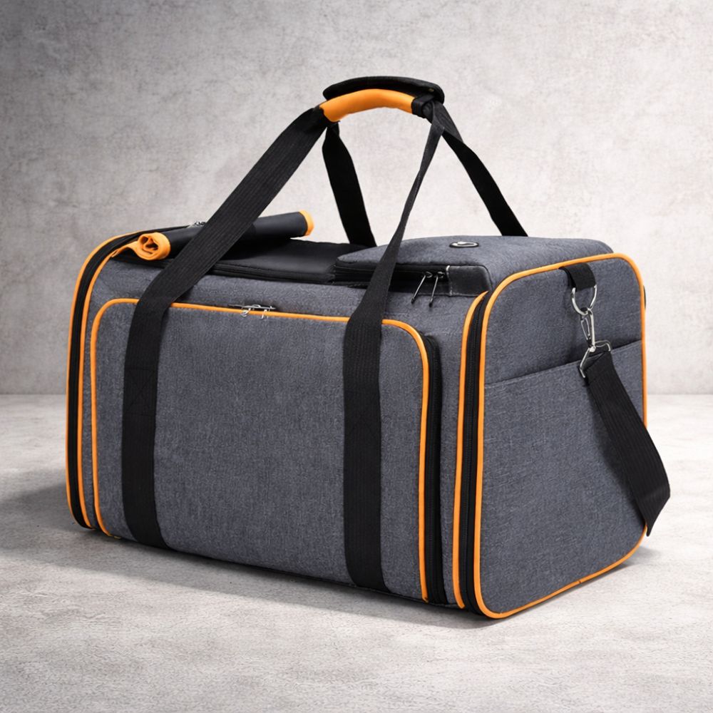 sac de transport pour chien gris avec bordures orange et structure renforcée pour voyager